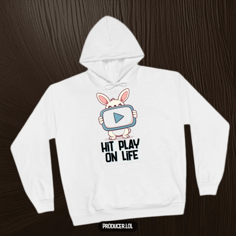 Cozy hoodie featuring a smiling bunny with a determined look, holding a giant PLAY button.