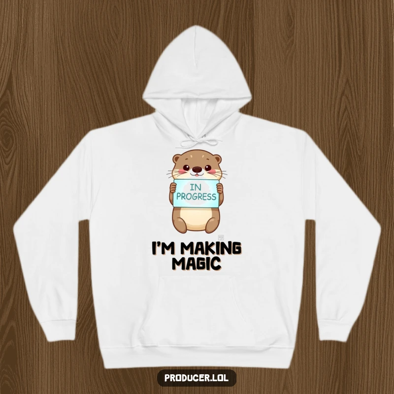 Funny otter hoodie, happy otter, holding 'In Progress' sign, cozy and warm, motivational clothing.